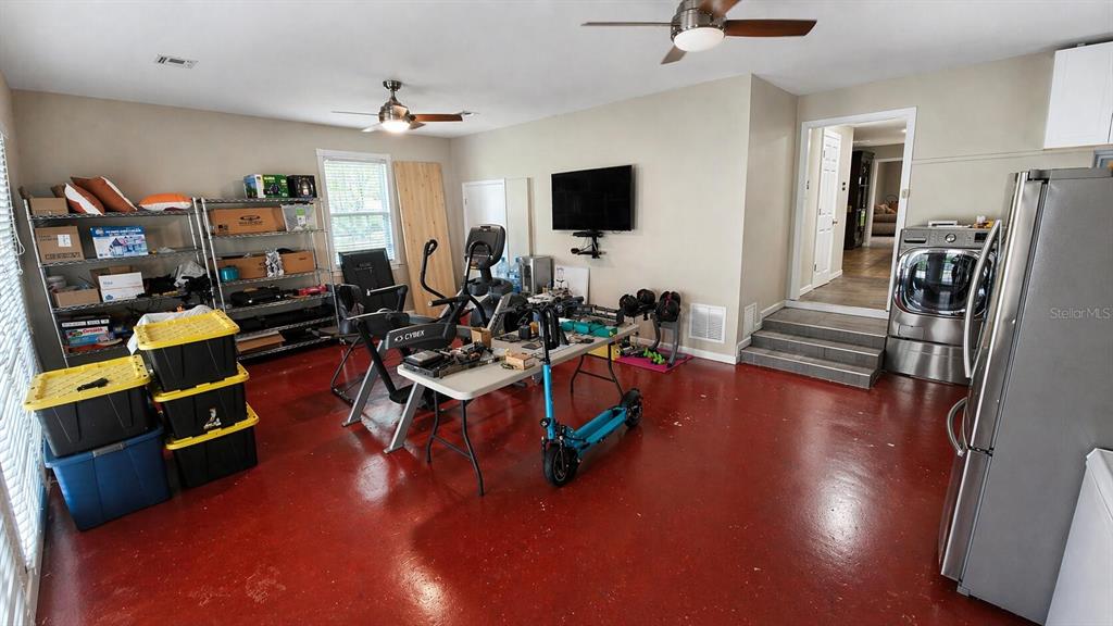 2313 Southeast 7th Street Ocala, FL 34471 - Photo 22 of 54 a living room with furniture and a flat screen tv