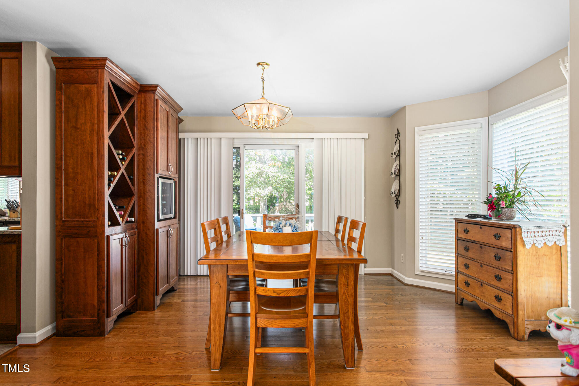 809 Brookview Drive Elon, NC 27244 - Photo 8 of 53 a view of a dining room with furniture window and wooden floor