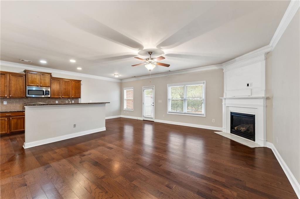 3803 Manor View Alpharetta, GA 30004 - Photo 14 of 33 a view of an empty room with a kitchen and a fireplace
