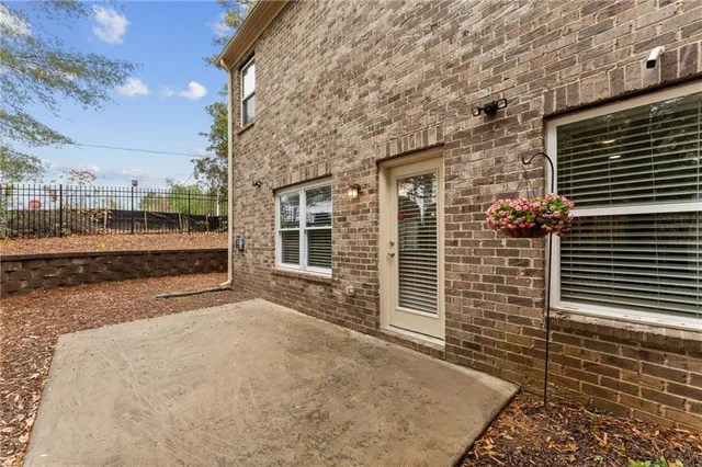 a view of a brick house with a large window