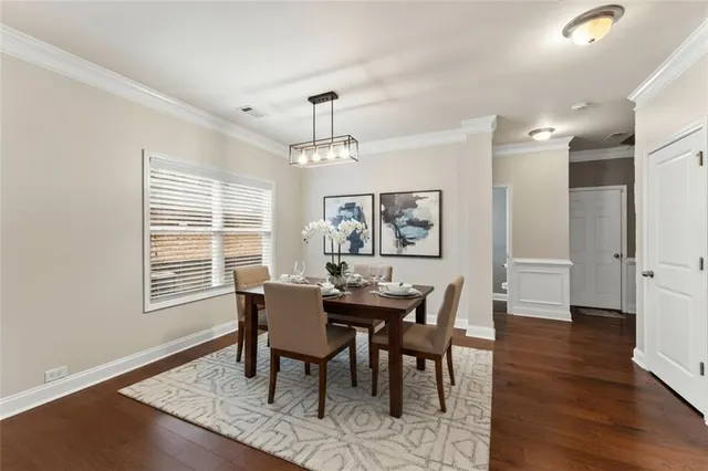 a view of a dining room with furniture window and wooden floor