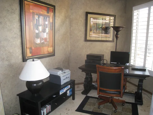 a workspace with furniture and window