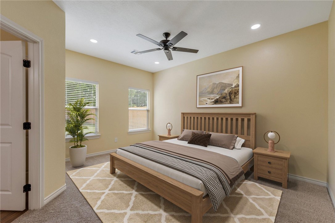 1108 Richard Street, Unit A Bryan, TX 77803 - Photo 15 of 23 a bedroom with a large bed and a window