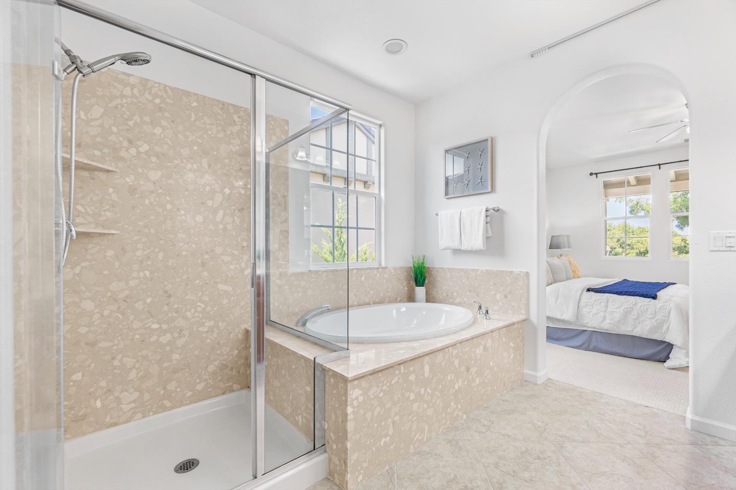 4232 Astor Hollow Street San Ramon, CA 94582 - Photo 20 of 37 a spacious bathroom with a granite countertop tub shower and sink