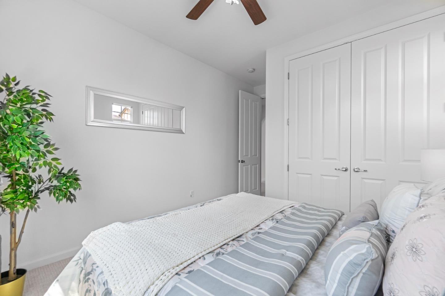 4232 Astor Hollow Street San Ramon, CA 94582 - Photo 28 of 37 a bedroom with a bed and a potted plant