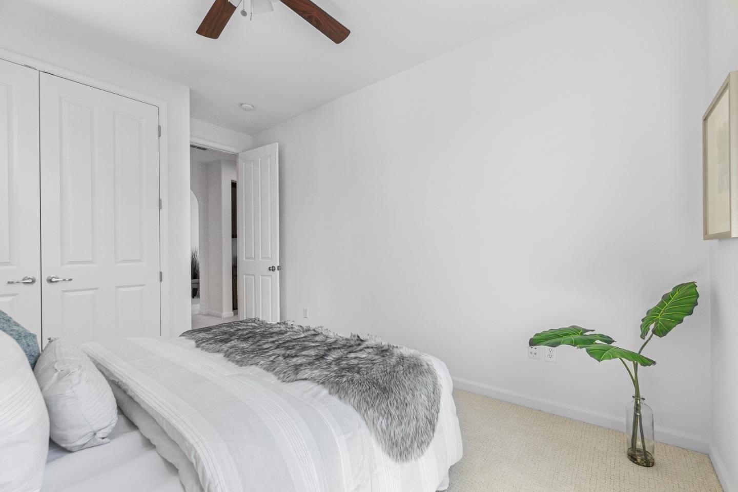 4232 Astor Hollow Street San Ramon, CA 94582 - Photo 30 of 37 a bedroom with a bed and a potted plant