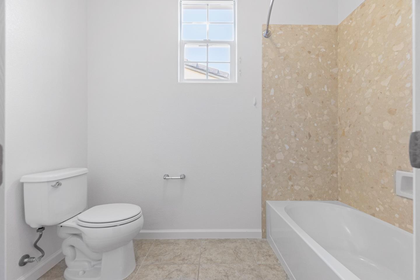 4232 Astor Hollow Street San Ramon, CA 94582 - Photo 32 of 37 a bathroom with a toilet and a bathtub