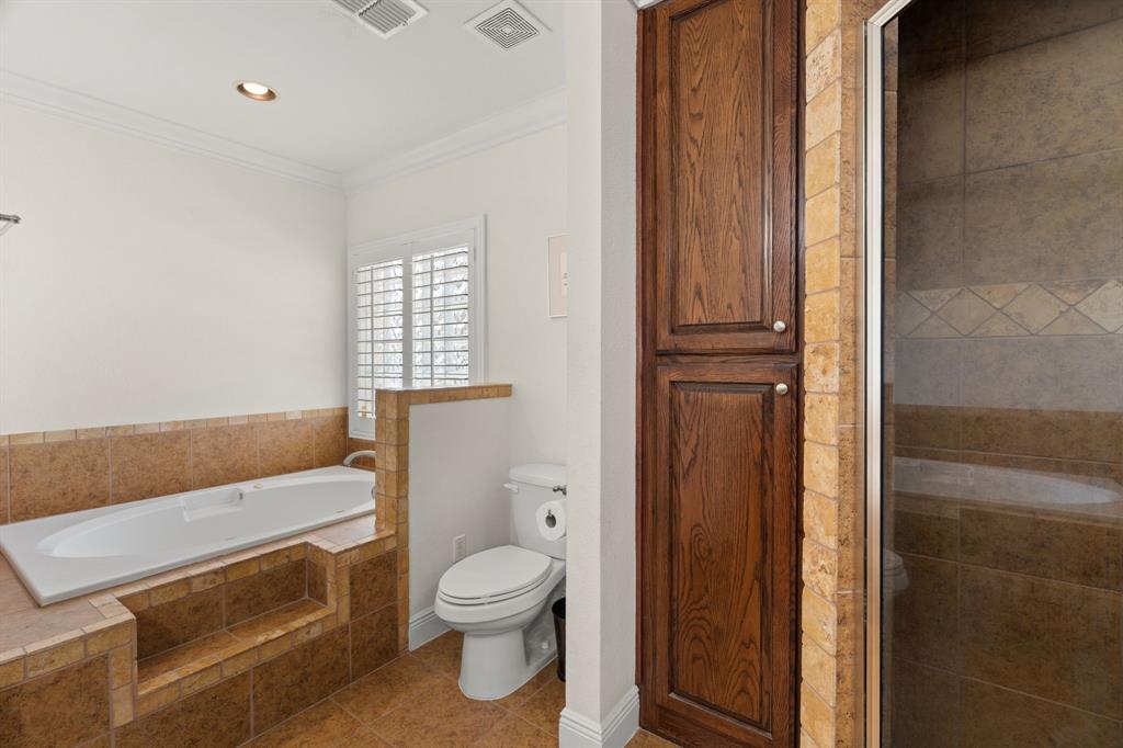 112 Waterfall Court Azle, TX 76020 - Photo 20 of 40 a bathroom with a sink a toilet and shower