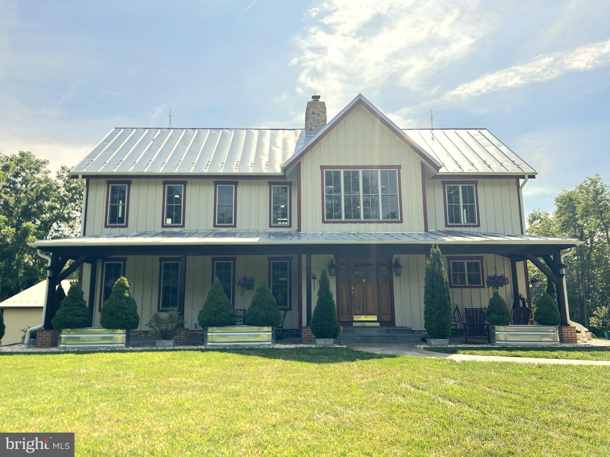 14301 Tower Road Smithsburg, MD 21783 - Photo 1 of 127 a view of a house with swimming pool and a porch