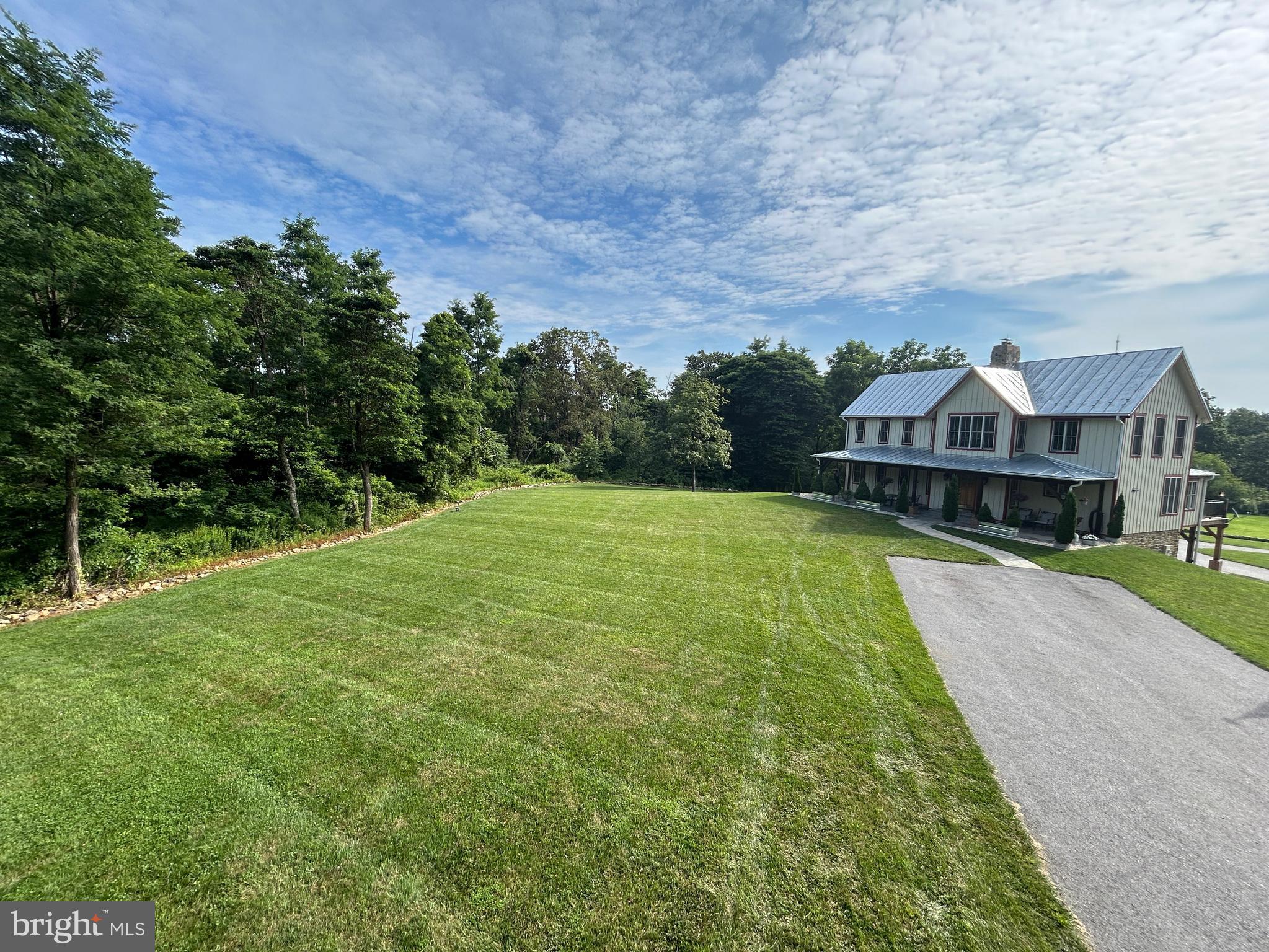 14301 Tower Road Smithsburg, MD 21783 - Photo 106 of 127 a view of a house with a big yard and large trees