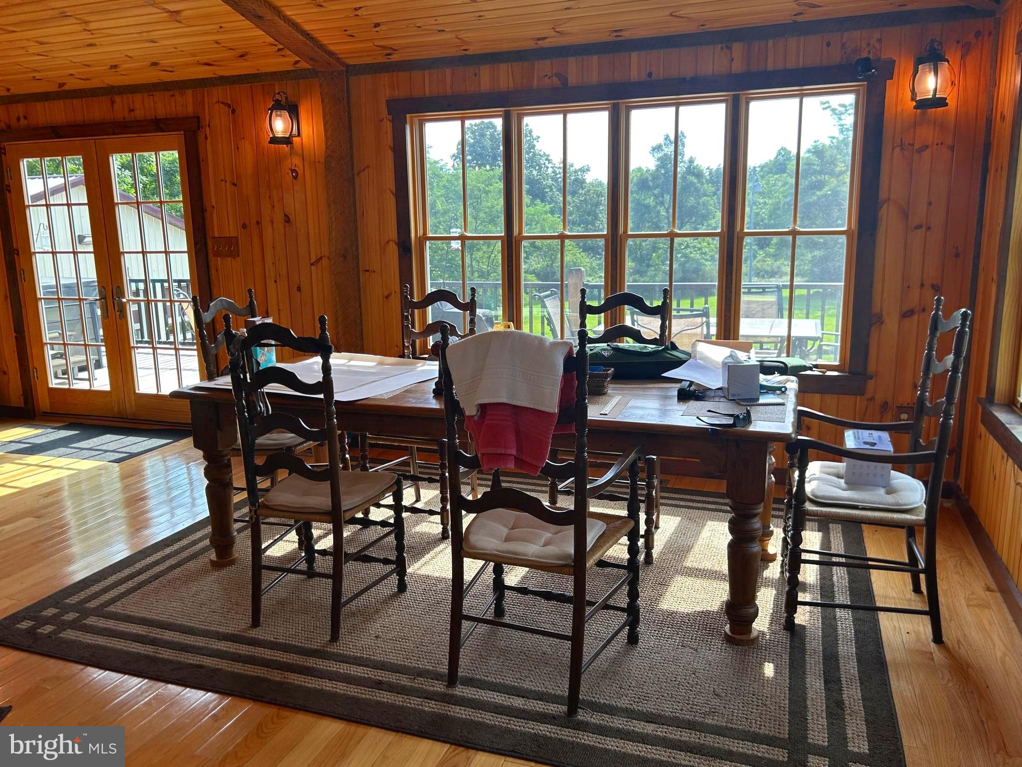 14301 Tower Road Smithsburg, MD 21783 - Photo 13 of 127 a view of a dining room with furniture large windows and wooden floor