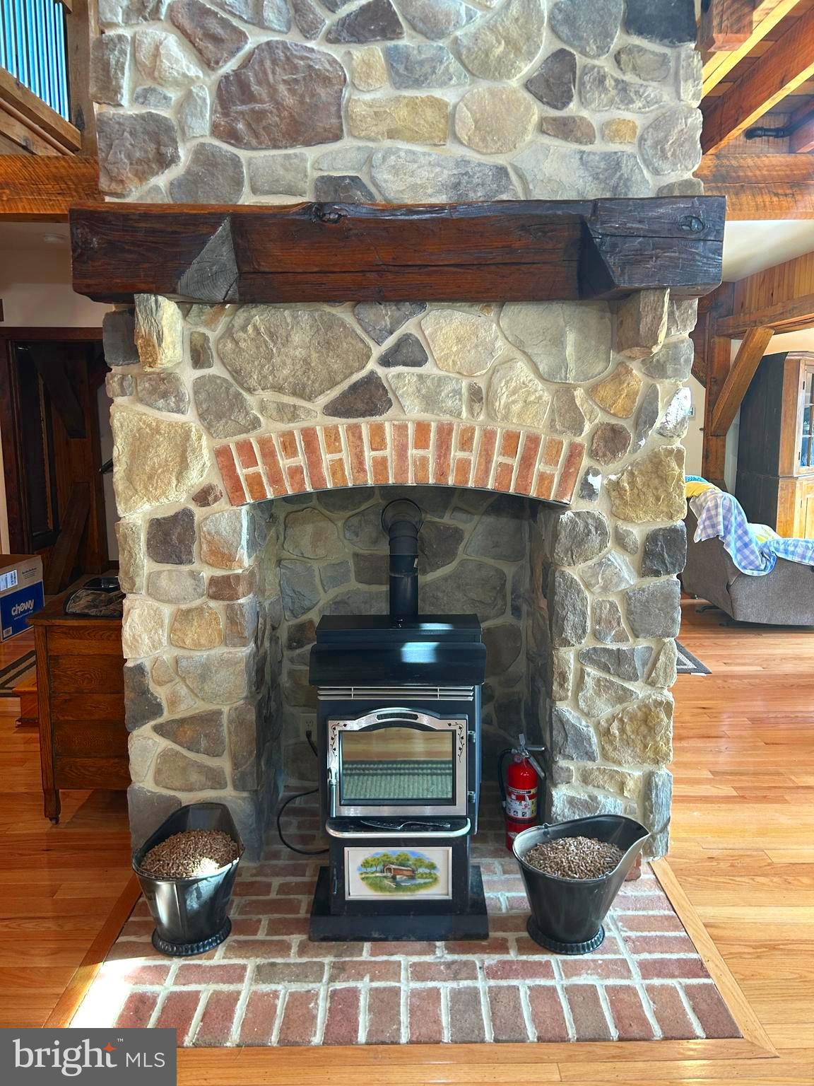 14301 Tower Road Smithsburg, MD 21783 - Photo 14 of 127 a room with fireplace and wooden floor