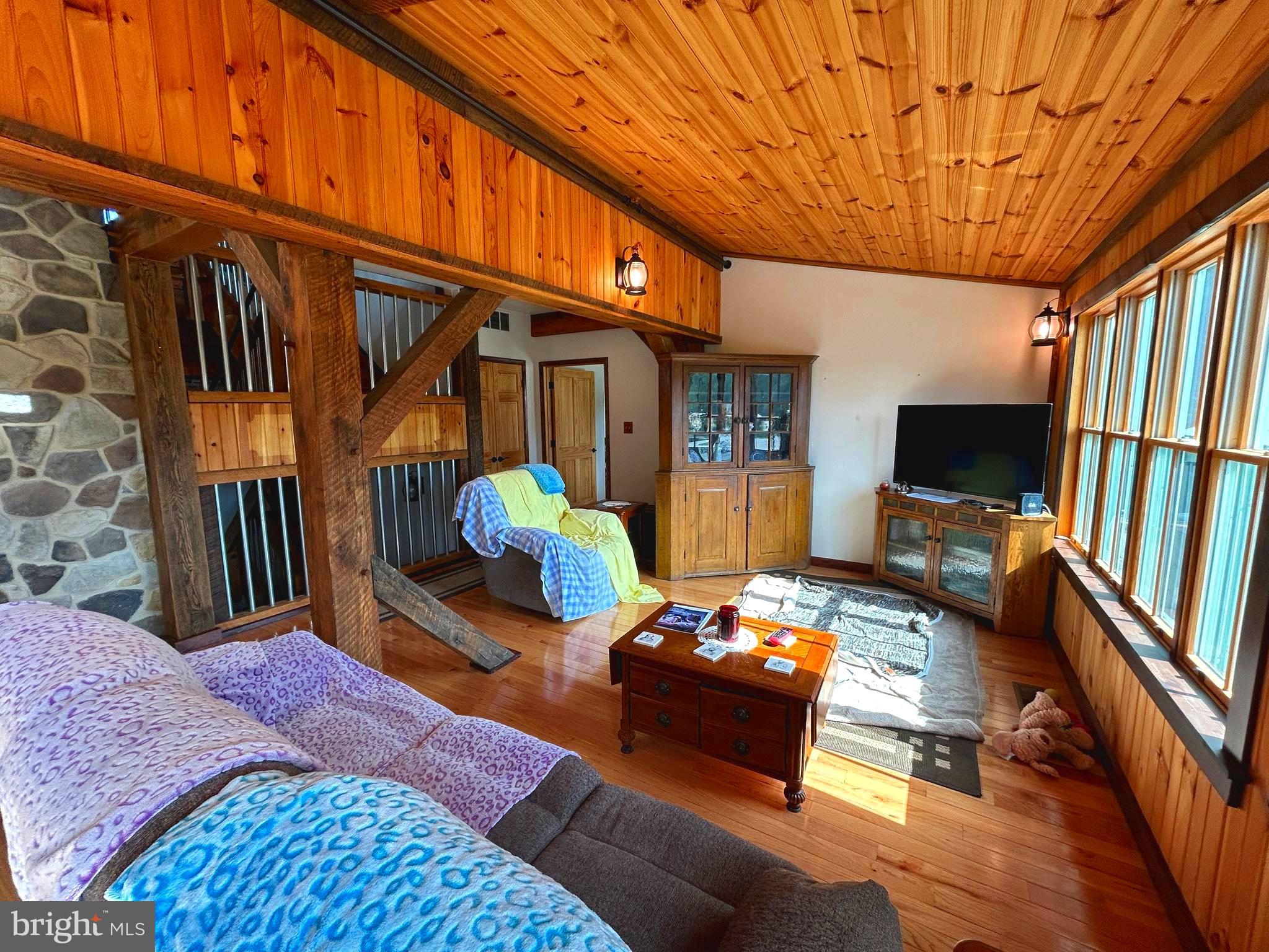 14301 Tower Road Smithsburg, MD 21783 - Photo 17 of 127 a bedroom with furniture a flat screen tv and a table
