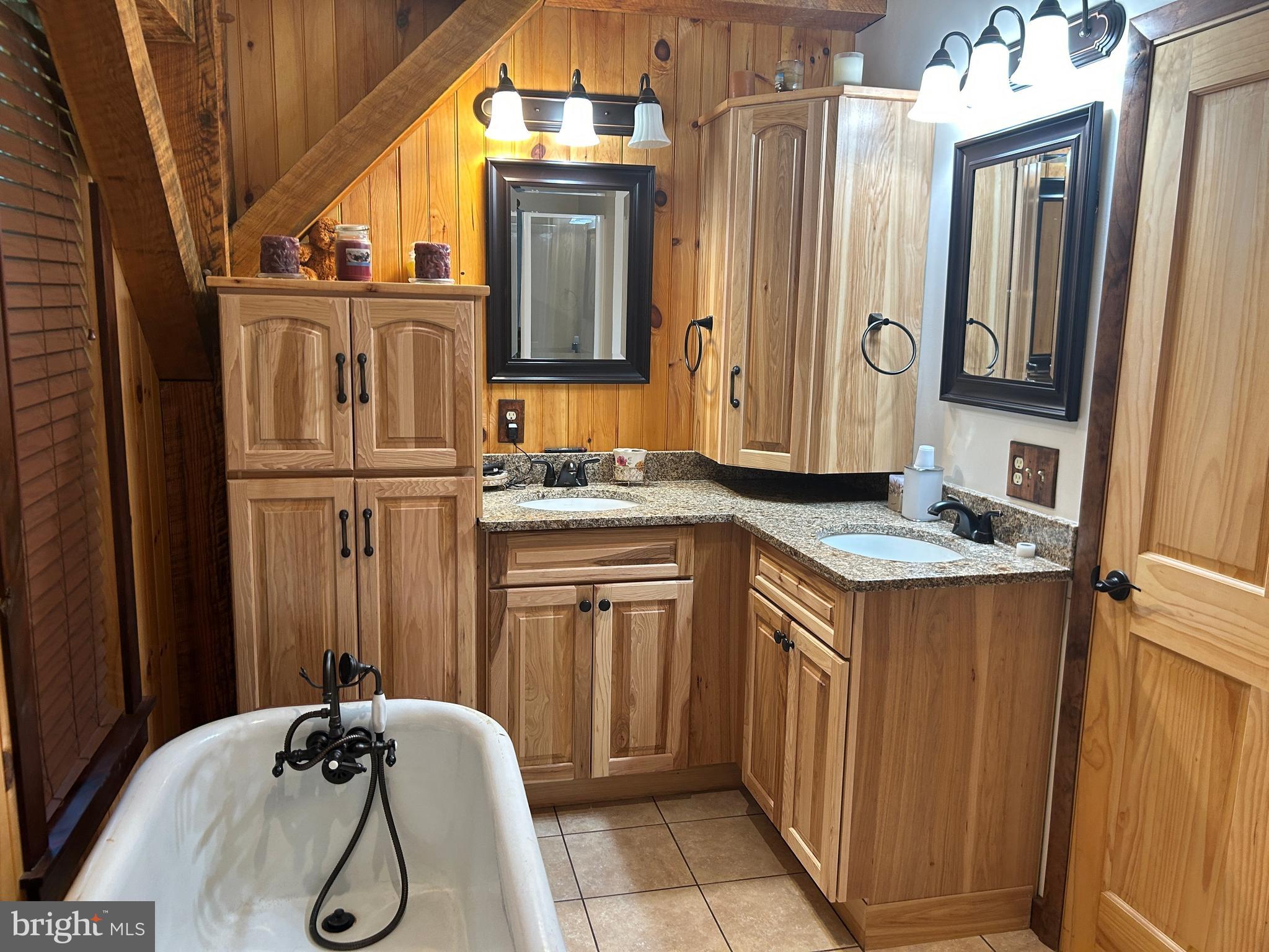 14301 Tower Road Smithsburg, MD 21783 - Photo 29 of 127 a bathroom with a granite countertop sink and a mirror