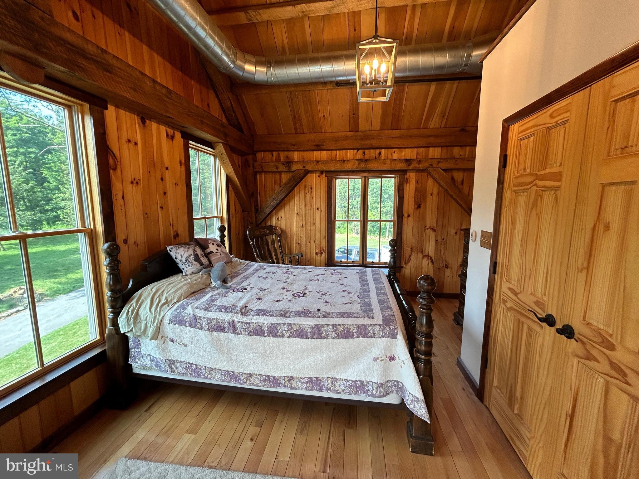 14301 Tower Road Smithsburg, MD 21783 - Photo 45 of 127 a bed sitting in a bedroom next to a window