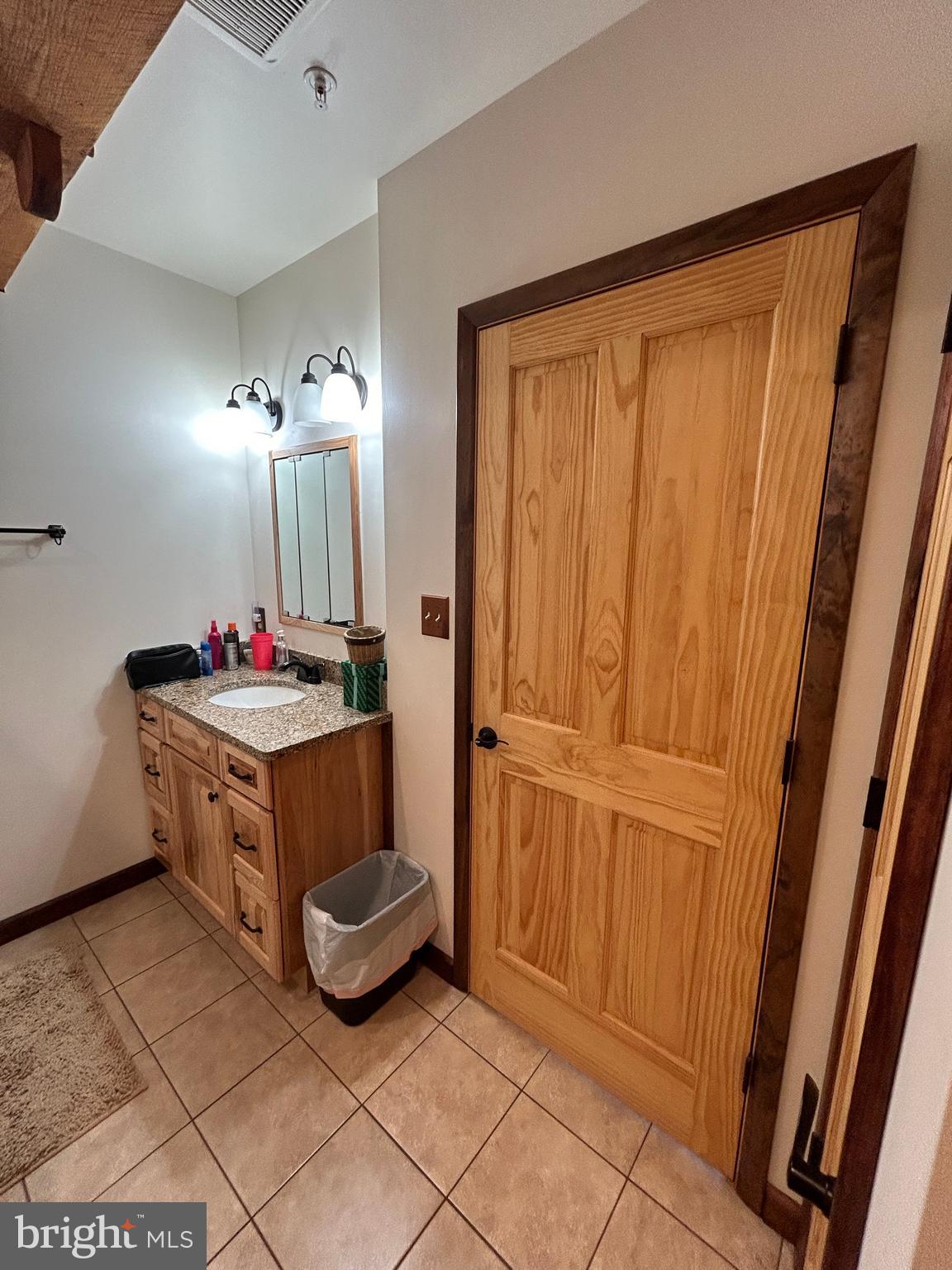14301 Tower Road Smithsburg, MD 21783 - Photo 49 of 127 a spacious bathroom with a mirror and vanity