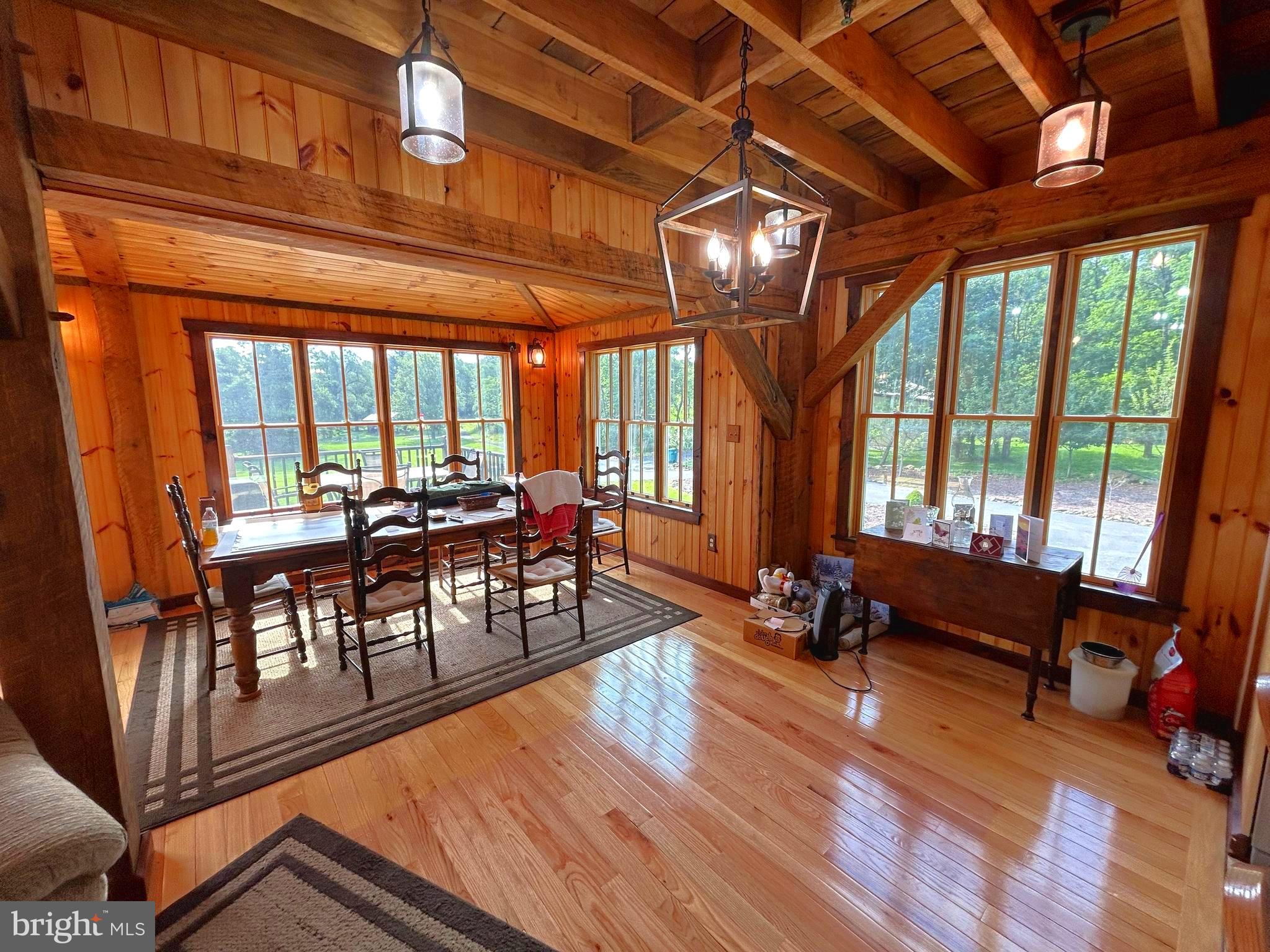 14301 Tower Road Smithsburg, MD 21783 - Photo 9 of 127 a view of a dining room with furniture a chandelier and wooden floor