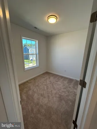 a white toilet and tub sitting next to a bathroom sink