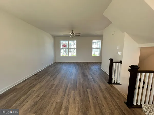a view of empty room with windows