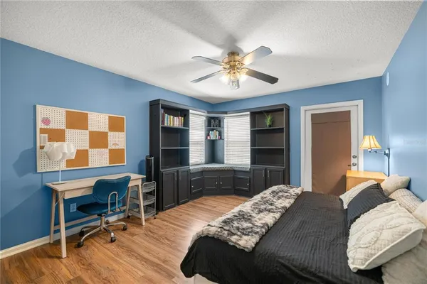 a house with swimming pool in front of it