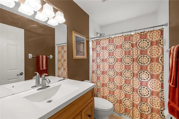 a bedroom with lots of furniture and baby bed