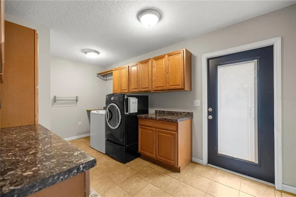 a front view of a house with a yard table and chairs