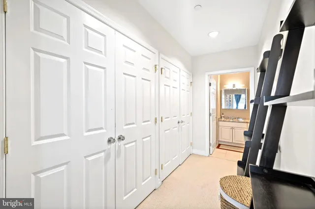 a view of entryway with furniture and wooden floor