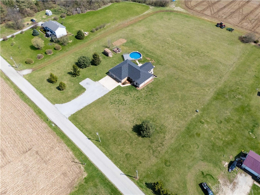 5264 Frazier-Guy Road Sidney, OH 45365 - Photo 51 of 51 This aerial perspective showcases a home nestled amidst lush green surroundings.