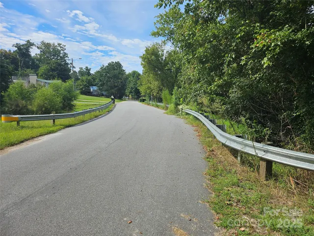 a view of a park with large trees
