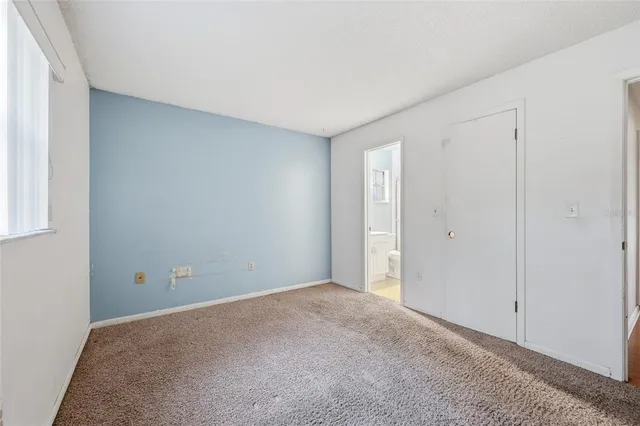 a view of staircase with white walls