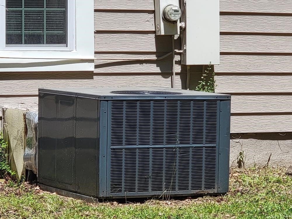 913 Chambliss Road Memphis, TN 38116 - Photo 15 of 16 Exterior air conditioning unit with horizontal slat siding, white window trim, and visible utility meter