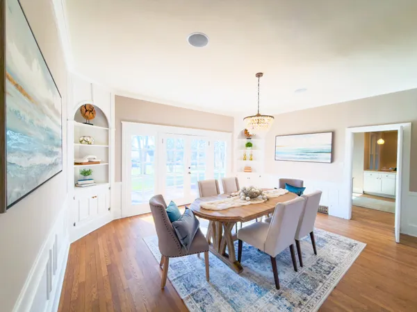 a view of a dining room with furniture window and outside view