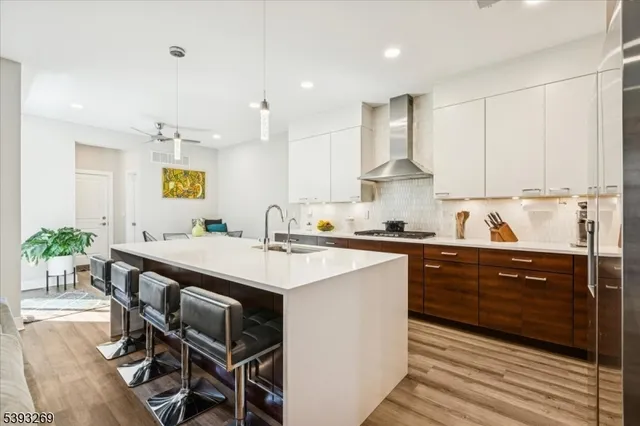 a kitchen with a table chairs stove and cabinets