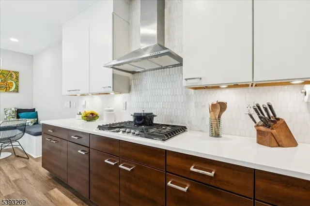 a kitchen with a sink a stove and cabinets