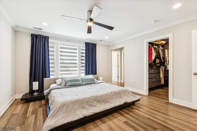 a bedroom with a bed and a walk in closet