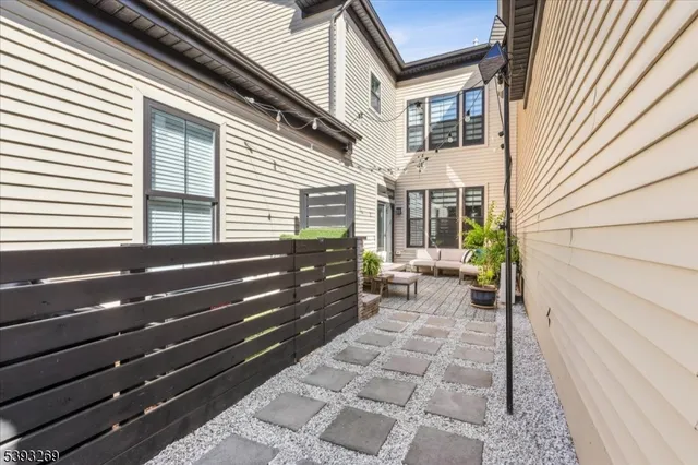 a view of a house with backyard and garden