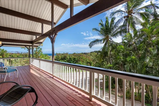 a view of balcony with wooden floor