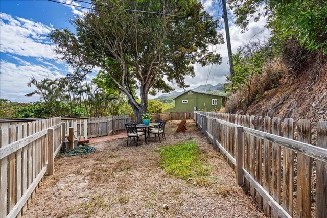 a house with trees in the background