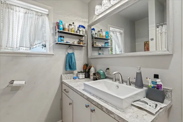 a bedroom with a bed and a couch