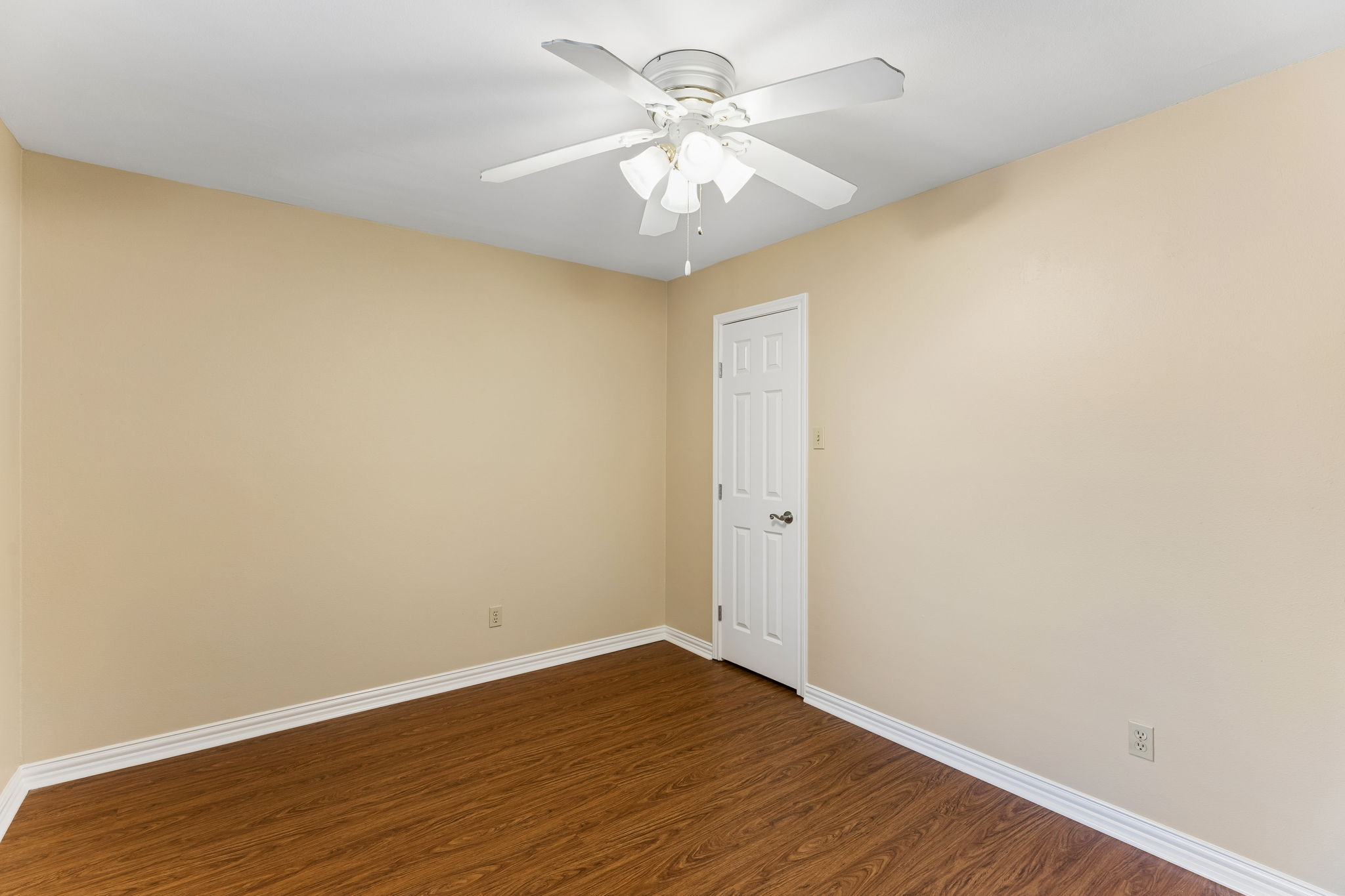 8340 Fathom Circle, Unit 103 Austin, TX 78750 - Photo 20 of 30 a view of an empty room with wooden floor