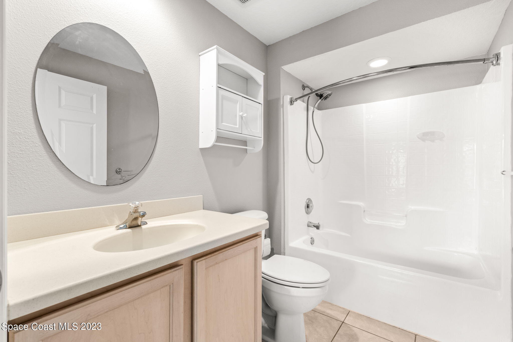 609 Cedar Side Circle Northeast Palm Bay, FL 32905 - Photo 11 of 19 a bathroom with a sink toilet and shower