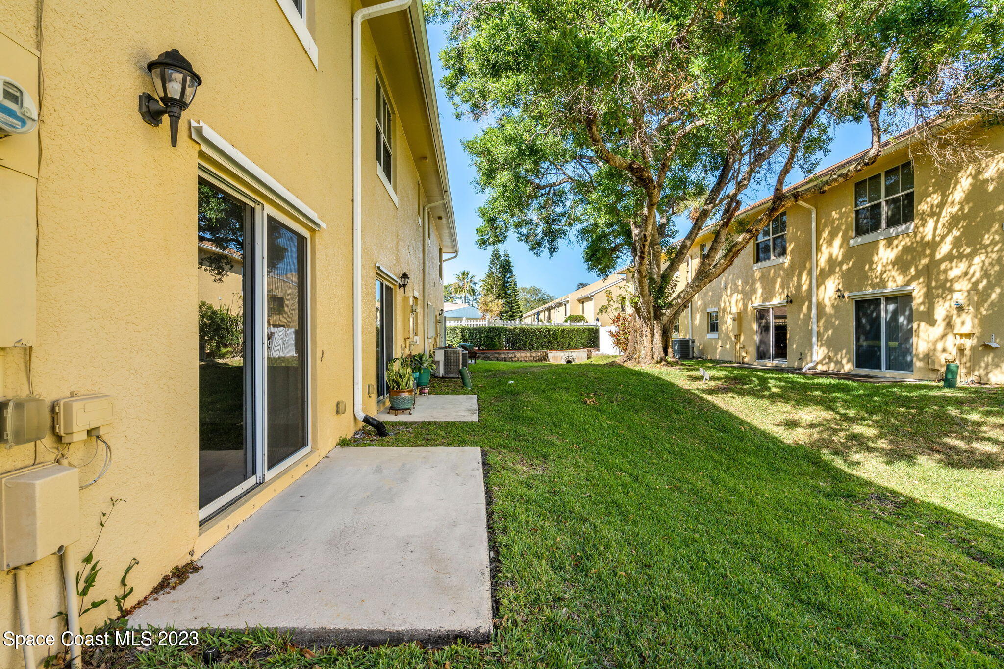 609 Cedar Side Circle Northeast Palm Bay, FL 32905 - Photo 12 of 19 a front view of a house with a yard