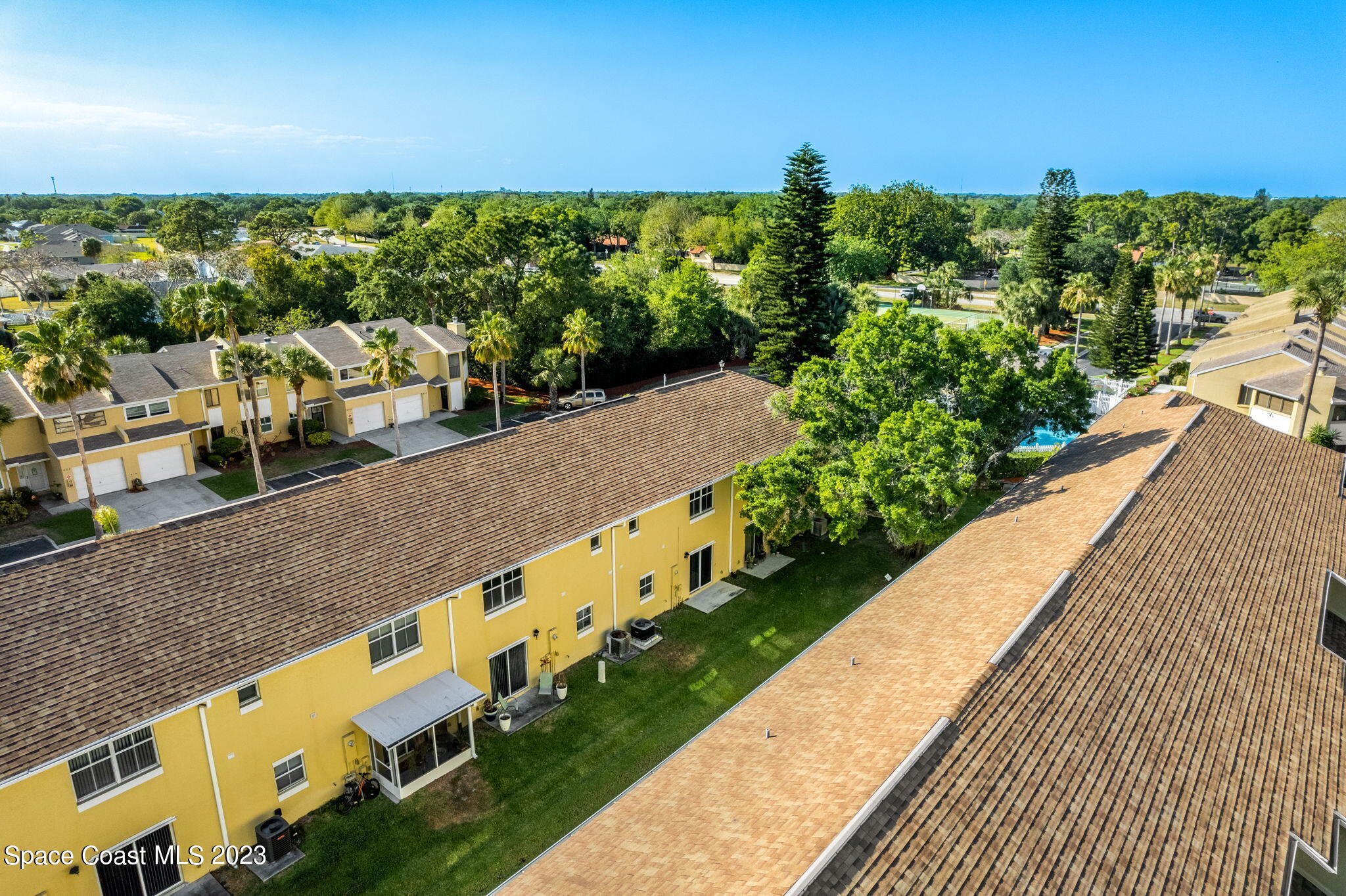 609 Cedar Side Circle Northeast Palm Bay, FL 32905 - Photo 13 of 19 a view of a yard with an outdoor seating
