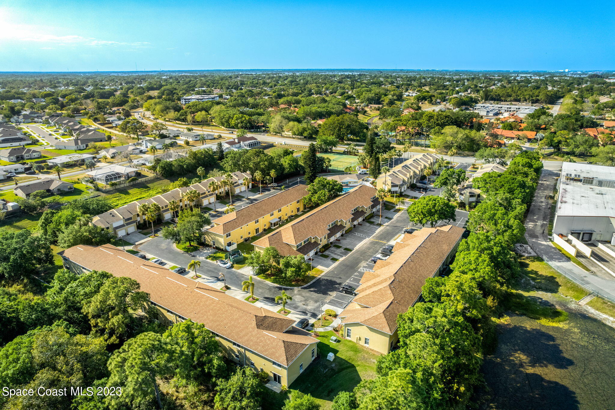 609 Cedar Side Circle Northeast Palm Bay, FL 32905 - Photo 14 of 19 an aerial view of residential houses with outdoor space
