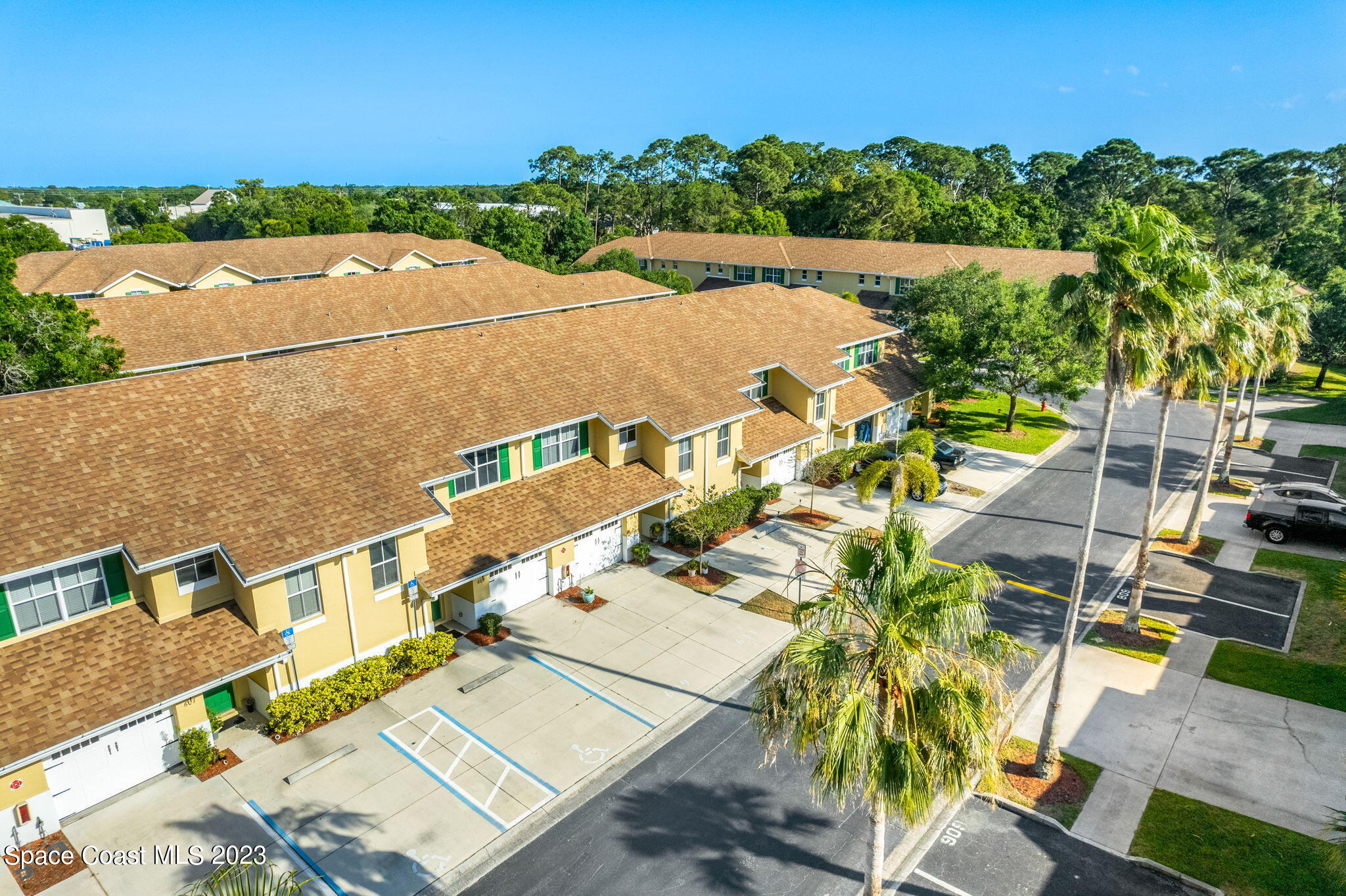 609 Cedar Side Circle Northeast Palm Bay, FL 32905 - Photo 17 of 19 an aerial view of a house with a garden