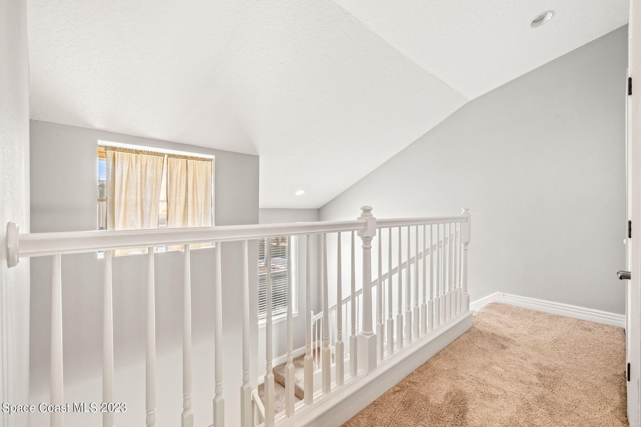 609 Cedar Side Circle Northeast Palm Bay, FL 32905 - Photo 7 of 19 a view of staircase with rug floor