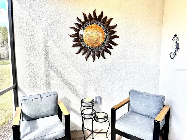 a work place with a chair and a painting on the wall