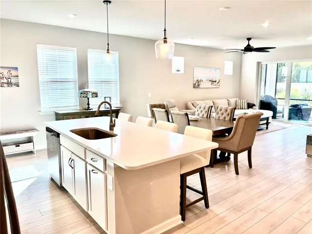 a kitchen with a stove a table and chairs