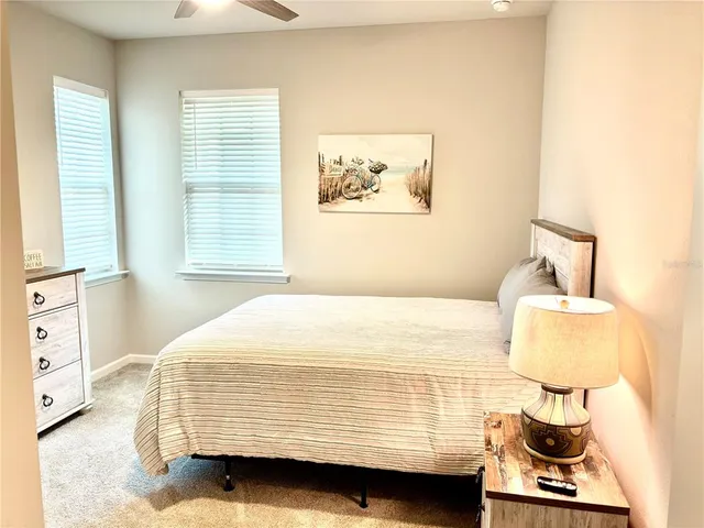 a bedroom with a bed and window