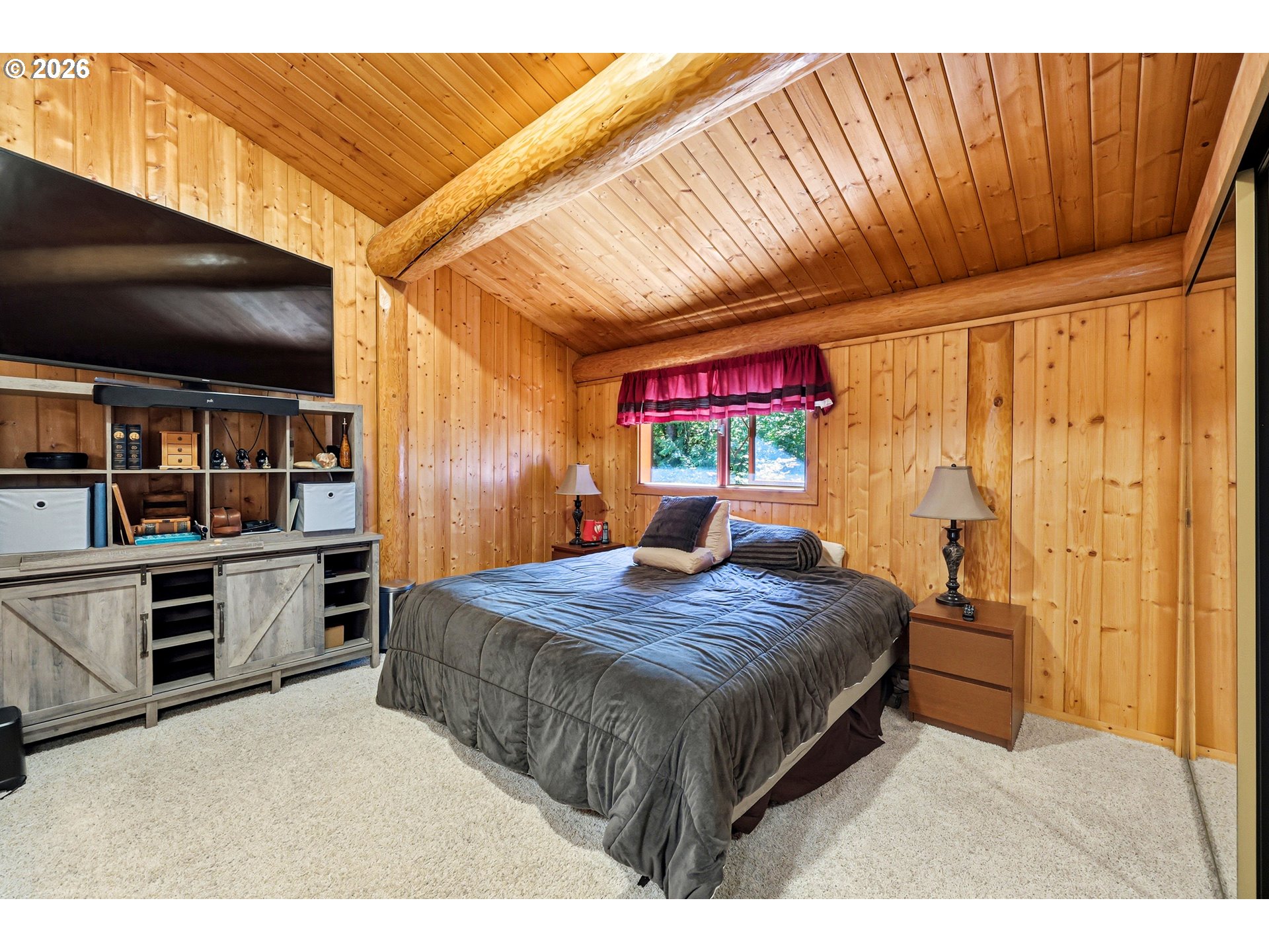 390 Spruce Creek Road Longview, WA 98632 - Photo 31 of 45 a bedroom with a bed and a flat screen tv